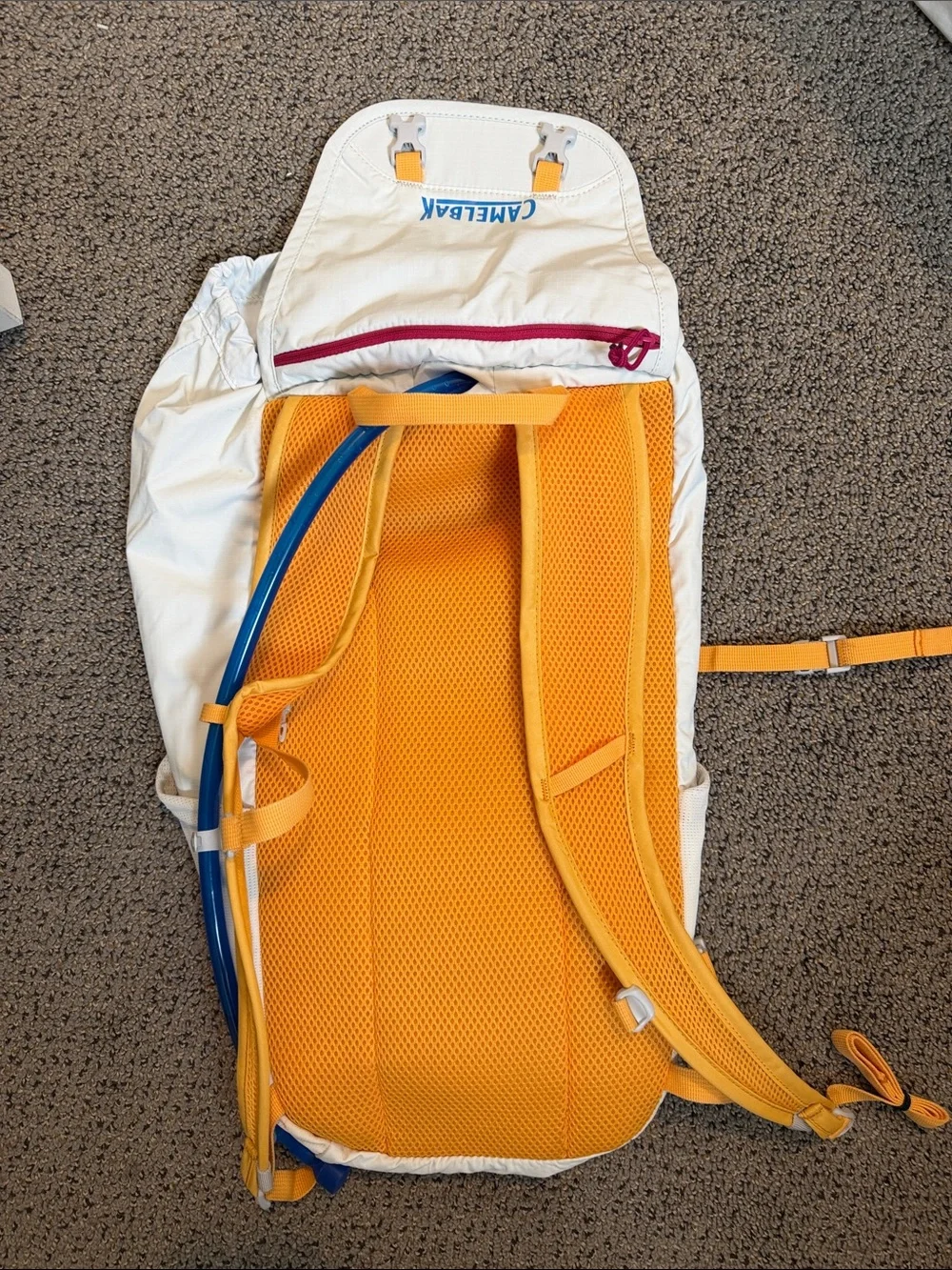 CamelBak white and orange Arete 18 hiking pack
